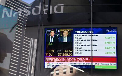 A television screen displays market news at the NASDAQ MarketSite in Times Square, New York City on April 9, 2025. (ANGELA WEISS / AFP)