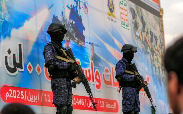 Members of Houthi-affiliated security forces stand guard during a rally in solidarity with Palestinians in the Gaza Strip and in condemnation of US strikes, in Yemen's Houthi-controlled capital Sanaa on April 11, 2025. (Mohammed HUWAIS / AFP)