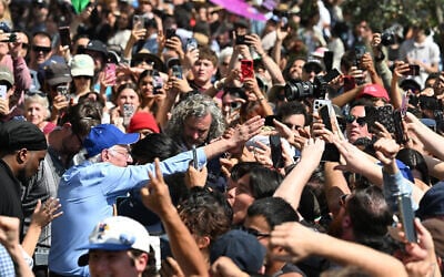 US Senator Bernie Sanders, Independent from Vermont, greets supporters after speaking at the "Fighting Oligarchy: Where We Go From Here" rally at Gloria Molina Grand Park in Los Angeles on April 12, 2025. (Photo by Robyn Beck / AFP)