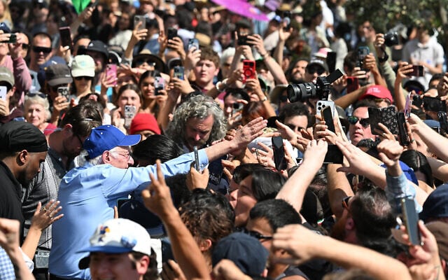 US Senator Bernie Sanders, Independent from Vermont, greets supporters after speaking at the "Fighting Oligarchy: Where We Go From Here" rally at Gloria Molina Grand Park in Los Angeles on April 12, 2025. (Photo by Robyn Beck / AFP) US Senator Bernie Sanders, Independent from Vermont, greets supporters after speaking at the "Fighting Oligarchy: Where We Go From Here" rally at Gloria Molina Grand Park in Los Angeles on April 12, 2025. (Photo by Robyn Beck / AFP)