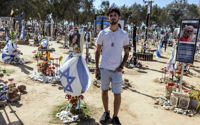 Shye Klein-Weinstein, a 28-year-old survivor of the October 7, 2023, massacre by Palestinian terrorists, poses for a picture at a memorial to the victims of the Nova Musical Festival in Kibbutz Re'im in southern Israel on March 30, 2025. (Menahem KAHANA / AFP) Shye Klein-Weinstein, a 28-year-old survivor of the October 7, 2023, massacre by Palestinian terrorists, poses for a picture at a memorial to the victims of the Nova Musical Festival in Kibbutz Re'im in southern Israel on March 30, 2025. (Menahem KAHANA / AFP)