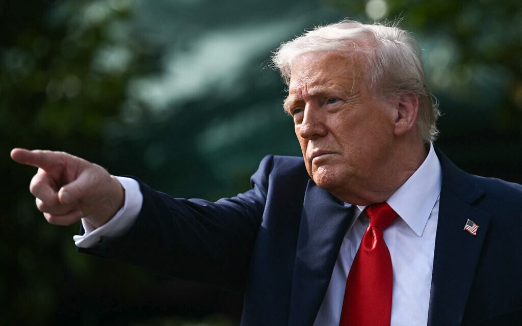 US President Donald Trump gestures after hosting the 2025 College Football National Champions, Ohio State Buckeyes, celebrating the team's title-winning season with a ceremony on the South Lawn of the White House in Washington, DC, April 14, 2025. (Brendan SMIALOWSKI / AFP)