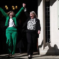 Susan Smith (L) and Marion Calder, directors of For Women Scotland celebrate as they leave Britain's Supreme Court in London on April 16, 2025, following the court's ruling on how to define a 'woman'. (HENRY NICHOLLS / AFP)