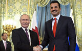 Russian President Vladimir Putin, left, shakes hands with Qatar's Emir Sheikh Tamim bin Hamad Al-Thani during a meeting at the Kremlin in Moscow, Russia, April 17, 2025. (Alexander Nemenov / Pool / AFP)