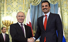 Russian President Vladimir Putin, left, shakes hands with Qatar's Emir Sheikh Tamim bin Hamad Al-Thani during a meeting at the Kremlin in Moscow, Russia, April 17, 2025. (Alexander Nemenov / Pool / AFP)