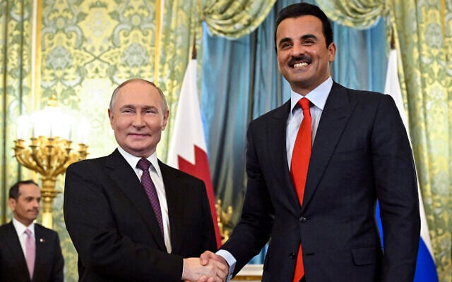 Russian President Vladimir Putin, left, shakes hands with Qatar's Emir Sheikh Tamim bin Hamad Al-Thani during a meeting at the Kremlin in Moscow, Russia, April 17, 2025. (Alexander Nemenov / Pool / AFP)