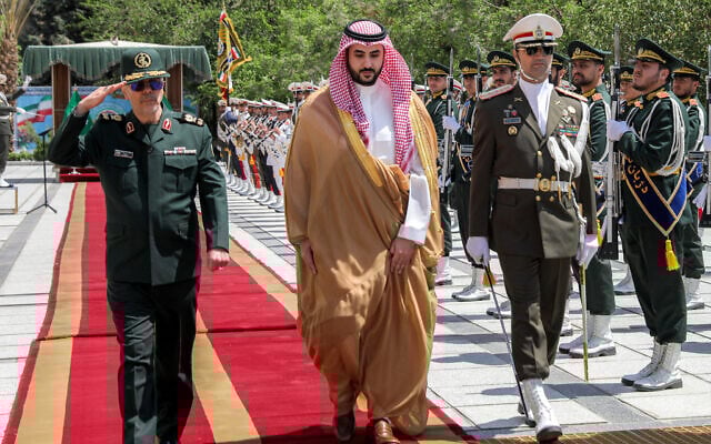 Iran's Armed Forces Chief of Staff Major-General Mohammed Bagheri (L) receiving Saudi Arabia's Defense Minister Prince Khalid bin Salman (C) in Tehran on April 17, 2025. (Iranian Army Office / AFP)