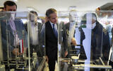 This handout picture made available by the Atomic Energy Organization of Iran (AEOI) office shows Director-General of the International Atomic Energy Agency (IAEA) Rafael Grossi (C) during a tour of the organization headquarters in Tehran with the head of the AEOI on April 17, 2025. (Atomic Energy Organization of Iran / AFP)