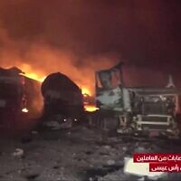 This grab taken from footage released by al-Masirah TV station of Yemen's Houthis shows fire and destruction at the site of US strikes on the Ras Issa fuel port in western Yemen on April 18, 2025 (Al-Masirah TV/AFP)