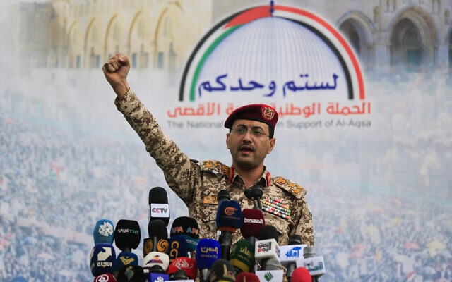 Brigadier Yahya Saree Qasim, the spokesman for Yemen's Houthis, gestures as he speaks during a protest to denounce US airstrikes on Yemen, in Sanaa on April 18, 2025. (MOHAMMED HUWAIS / AFP)