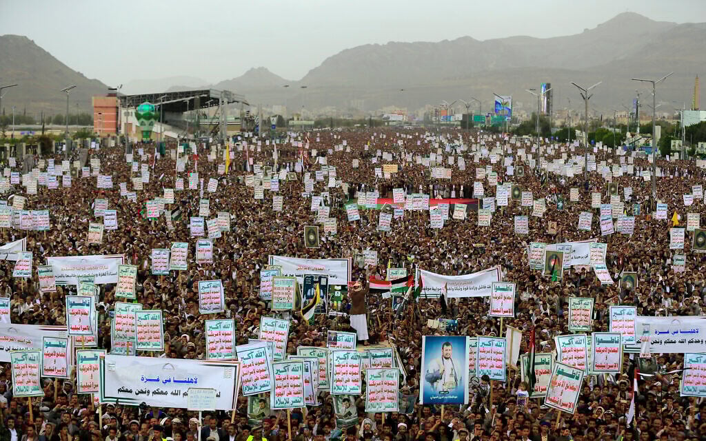 Demonstrators hold placards and chant slogans during a rally in solidarity with Palestinians in the Gaza Strip and in condemnation of US strikes, in Yemen's Houthi-controlled capital Sanaa on April 18, 2025 (Mohammed Huwais/AFP)