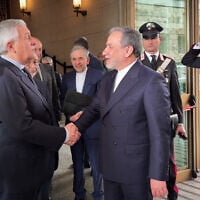 Italian Foreign Minister Antonio Tajani (L) meets with Iranian Foreign Minister Abbas Araqchi at the Italian Foreign Ministry in Rome before Iran-US nuclear talks Iran at the Omani embassy, April 19, 2025. (Italian Foreign Ministry via AFP)