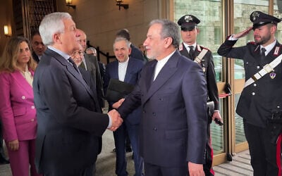 Italian Foreign Minister Antonio Tajani (L) meets with Iranian Foreign Minister Abbas Araqchi at the Italian Foreign Ministry in Rome before Iran-US nuclear talks Iran at the Omani embassy, April 19, 2025. (Italian Foreign Ministry via AFP)