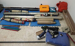 A handout picture provided by the Lebanese armed forces on April 20, 2025, shows weapons that the army said were seized after troops searched an apartment in the Sidon-Zahrani area in southern Lebanon. (Lebanese Armed Forces / AFP)