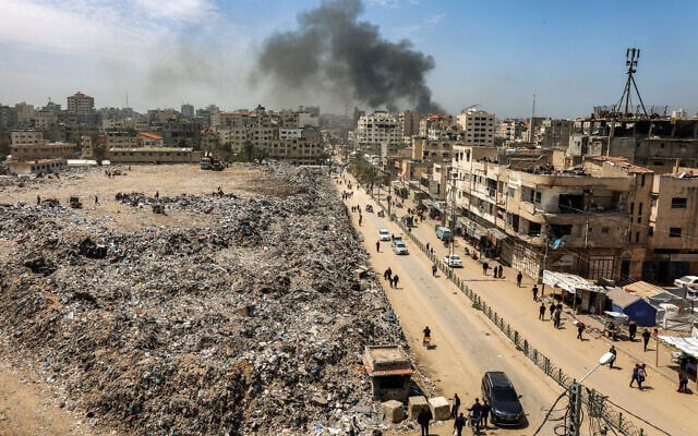 Mounds of trash are seen at the former site of the Firas Market in Gaza City, which was transformed into a landfill during the war, on April 21, 2025. (Omar AL-QATTAA / AFP)