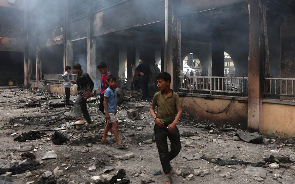 Palestinians inspect the damage after an Israeli strike in Gaza City on April 23, 2025. (Omar Al-Qattaa/AFP)