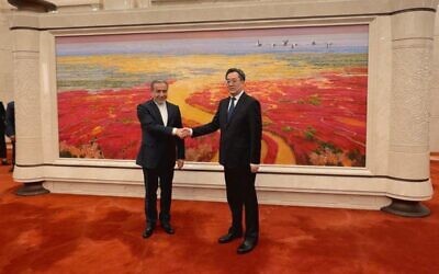 Chinese Vice Premier Ding Xuexiang (R) welcoming Iran's Foreign Minister Abbas Araghchi in Beijing on April 23, 2025. (Iranian Foreign Ministry / AFP) Chinese Vice Premier Ding Xuexiang (R) welcoming Iran's Foreign Minister Abbas Araghchi in Beijing on April 23, 2025. (Iranian Foreign Ministry / AFP)