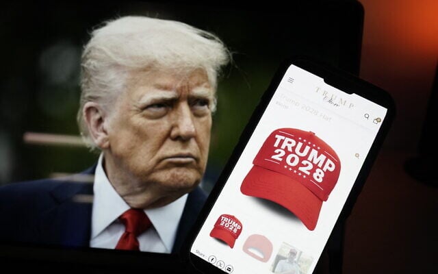 This photo illustration, taken on April 24, 2025, in Washington, DC, shows an image of US President Donald Trump alongside a smartphone displaying a red 'Trump 2028' cap on the Trump Store website (Oliver Contreras / AFP) This photo illustration, taken on April 24, 2025, in Washington, DC, shows an image of US President Donald Trump alongside a smartphone displaying a red 'Trump 2028' cap on the Trump Store website (Oliver Contreras / AFP)
