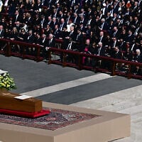 The book of the gospels lays on the coffin of late Pope Francis during the funeral ceremony at St Peter's Square in the Vatican on April 26, 2025. (Photo by Tiziana FABI / AFP)