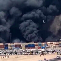 This image grab taken from footage released by the state television Islamic Republic of Iran Broadcasting News (IRIBNEWS) on April 26, 2025 shows thick black smoke billowing following an explosion at the Shahid Rajaee port dock southwest of Bandar Abbas (Photo by IRIBNEWS / AFP)