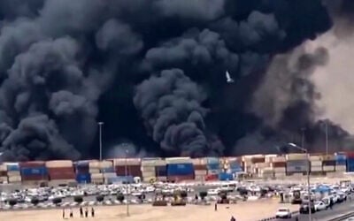 This image grab taken from footage released by the state television Islamic Republic of Iran Broadcasting News (IRIBNEWS) on April 26, 2025 shows thick black smoke billowing following an explosion at the Shahid Rajaee port dock southwest of Bandar Abbas (Photo by IRIBNEWS / AFP)
