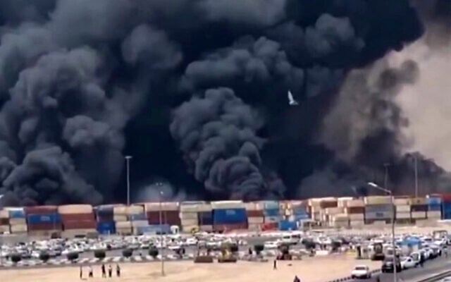 This image grab taken from footage released by the state television Islamic Republic of Iran Broadcasting News (IRIBNEWS) on April 26, 2025 shows thick black smoke billowing following an explosion at the Shahid Rajaee port dock southwest of Bandar Abbas (Photo by IRIBNEWS / AFP)