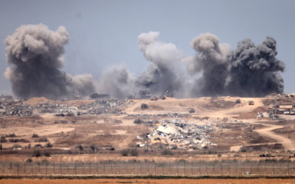Smoke plumes rising following explosions inside the Gaza Strip, on April 27, 2025. (Menahem KAHANA / AFP)