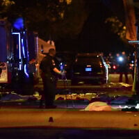 Vancouver Police investigate a crime scene after a man drove into pedestrians at the annual Lapu Lapu festival celebrating Filipino culture, at East 43rd Avenue and Fraser, in the south of Vancouver, Canada, on April 26, 2025. (Don MacKinnon / AFP)