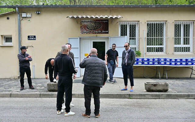 People stand outside the mosque Khadija in La Grand-Combe, southern France, on April 27, 2025, following the murder of Aboubakar, a worshiper killed inside the mosque on April 25. (Miguel MEDINA / AFP) People stand outside the mosque Khadija in La Grand-Combe, southern France, on April 27, 2025, following the murder of Aboubakar, a worshiper killed inside the mosque on April 25. (Miguel MEDINA / AFP)