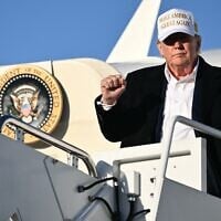 US President Donald Trump raises a fist as he steps off Air Force One upon arrival at Joint Base Andrews in Maryland on April 27, 2025. (Mandel Ngan/AFP)