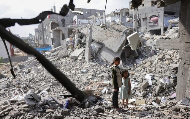 Palestinian girls look at the rubble of a home destroyed in Israeli strikes in Beit Lahia in the northern Gaza Strip on April 28, 2025. (BASHAR TALEB / AFP) Palestinian girls look at the rubble of a home destroyed in Israeli strikes in Beit Lahia in the northern Gaza Strip on April 28, 2025. (BASHAR TALEB / AFP)