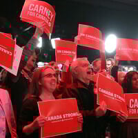 Supporters for Canada's Prime Minister and Liberal Party leader Mark Carney celebrate as results are announced during an election party in Ottawa, Canada April 28, 2025. (Dave Chan / AFP)