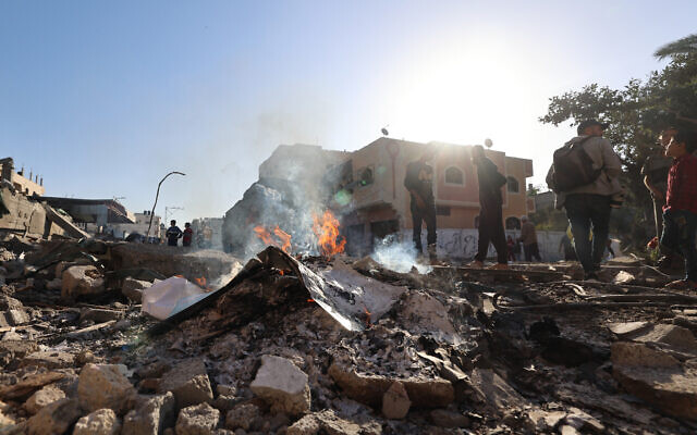 Palestinians inspect the damage, following overnight Israeli strikes, at the Nuseirat camp in the central Gaza Strip on April 29, 2025 (Eyad BABA / AFP)