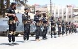 Syrian security forces standing guard in a street in the mostly Druze and Christian Jaramana suburb of Damascus on April 29, 2025. (Syrian Interior Ministry Facebook Page / AFP)