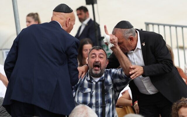 Avi Revah, the father of fallen Israeli soldier Dvir Revah, shouts at Knesset Speaker Amir Ohana (not pictured) during a Memorial Day ceremony at the Yad Labanim memorial in Jerusalem on April 29, 2025. (Abir Sultan/Pool/AFP)