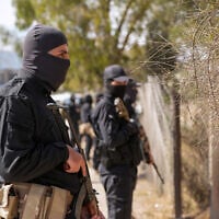 Security forces of Syria's new Islamist government stand guard on the road leading to the airport, in the Damascus' suburb of Jaramana on April 29, 2025. (Rami al SAYED / AFP)