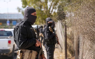 Security forces of Syria's new Islamist government stand guard on the road leading to the airport, in the Damascus' suburb of Jaramana on April 29, 2025. (Rami al SAYED / AFP)