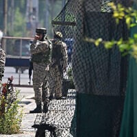 Indian paramilitary troopers stand guard along a street in Srinagar, on the Indian-administered side of Kashmir, on April 30, 2025. (Tauseef MUSTAFA / AFP)