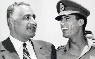 In this undated 1969 photo, Egypt's President Gamal Abdel Nasser, left, is seen with Libyan leader, Col.  Muammar Gaddafi, in Suez, Egypt. (AP Photo/ Farouk Ibrahim)