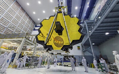 FILE - In this photo provided by NASA, technicians lift the mirror of the James Webb Space Telescope using a crane, April 13, 2017, at the Goddard Space Flight Center in Greenbelt, Md. (Laura Betz/NASA via AP, File)