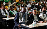 South African President Cyril Ramaphosa, first row left, listens in Johannesburg on January 26, 2024, to the ruling from the top UN court that harshly criticized Israel's war against the Hamas terror group in Gaza. (AP Photo)