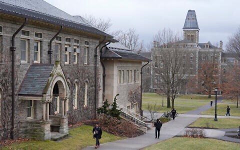 People walk on the campus of Cornell University in Ithaca, New York, February 2, 2024. (AP Photo/Seth Wenig)