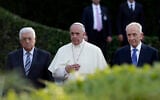 FILE - Pope Francis is flanked by Israel's President Shimon Peres, right, and PA President Mahmoud Abbas during an evening of peace prayers in the Vatican gardens, June 8, 2014. (AP Photo/Gregorio Borgia, File)
