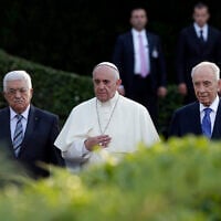 FILE - Pope Francis is flanked by Israel's President Shimon Peres, right, and PA President Mahmoud Abbas during an evening of peace prayers in the Vatican gardens, June 8, 2014. (AP Photo/Gregorio Borgia, File)