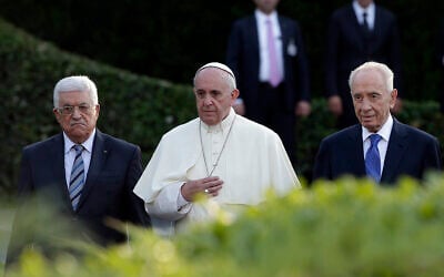 FILE - Pope Francis is flanked by Israel's President Shimon Peres, right, and PA President Mahmoud Abbas during an evening of peace prayers in the Vatican gardens, June 8, 2014. (AP Photo/Gregorio Borgia, File)