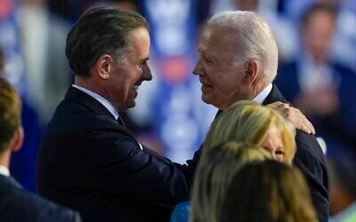 Then-US President Joe Biden, right, hugs his son Hunter Biden during the Democratic National Convention Monday, August 19, 2024, in Chicago, Illinois. (AP Photo/Matt Rourke)