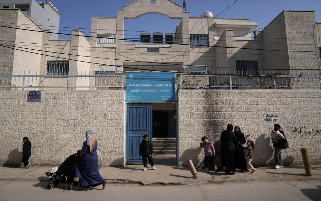 Palestinians gather outside of a health clinic run by the United Nations agency for Palestinian refugees, known as UNRWA, in the Shuafat refugee camp in Jerusalem, Monday, Jan. 27, 2025. (AP Photo/Mahmoud Illean) Palestinians gather outside of a health clinic run by the United Nations agency for Palestinian refugees, known as UNRWA, in the Shuafat refugee camp in Jerusalem, Monday, Jan. 27, 2025. (AP Photo/Mahmoud Illean)