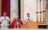 Pope Francis sits by the coffin of late Pope Emeritus Benedict XVI in St. Peter's Square during a funeral mass at the Vatican, on January 5, 2023. (Andrew Medichini/AP)