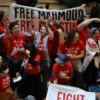 Demonstrators from the "Jewish Voice for Peace" group protest inside Trump Tower in support of Mahmoud Khalil, on March 13, 2025, in New York. (AP Photo/Yuki Iwamura)