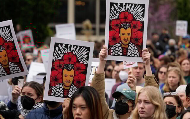 People hold signs in support of detained anti-Israel activist Mahmoud Khalil while protesting the Trump administration at the University of California, Berkeley campus, on March 19, 2025, in Berkeley, Calif. (AP Photo/Godofredo A. Vásquez)